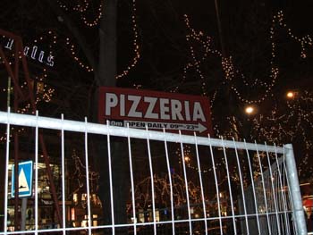 Sign on Wenceslas Square pointing to Astoria Pizza
